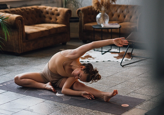Sunset with woman doing yoga pose.